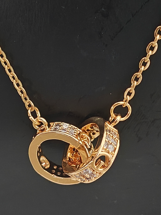 Anti tarnish golden coloured chain with interlocking stone studded band rings pendant